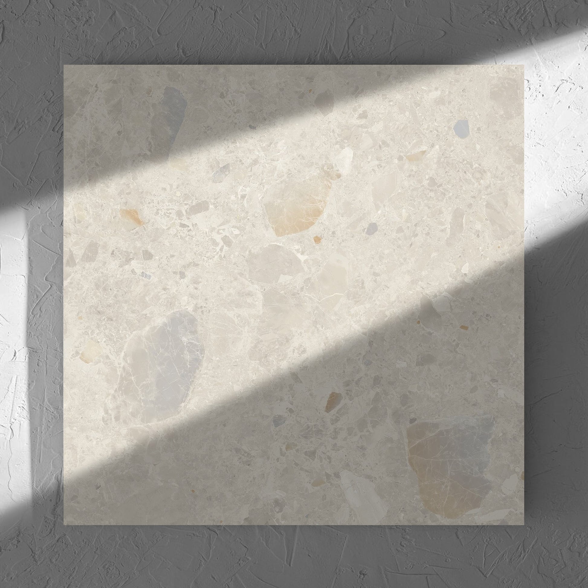 Terrazzo Rock Beige Matt 600x600mm tile in soft natural window light, showing the tile surface