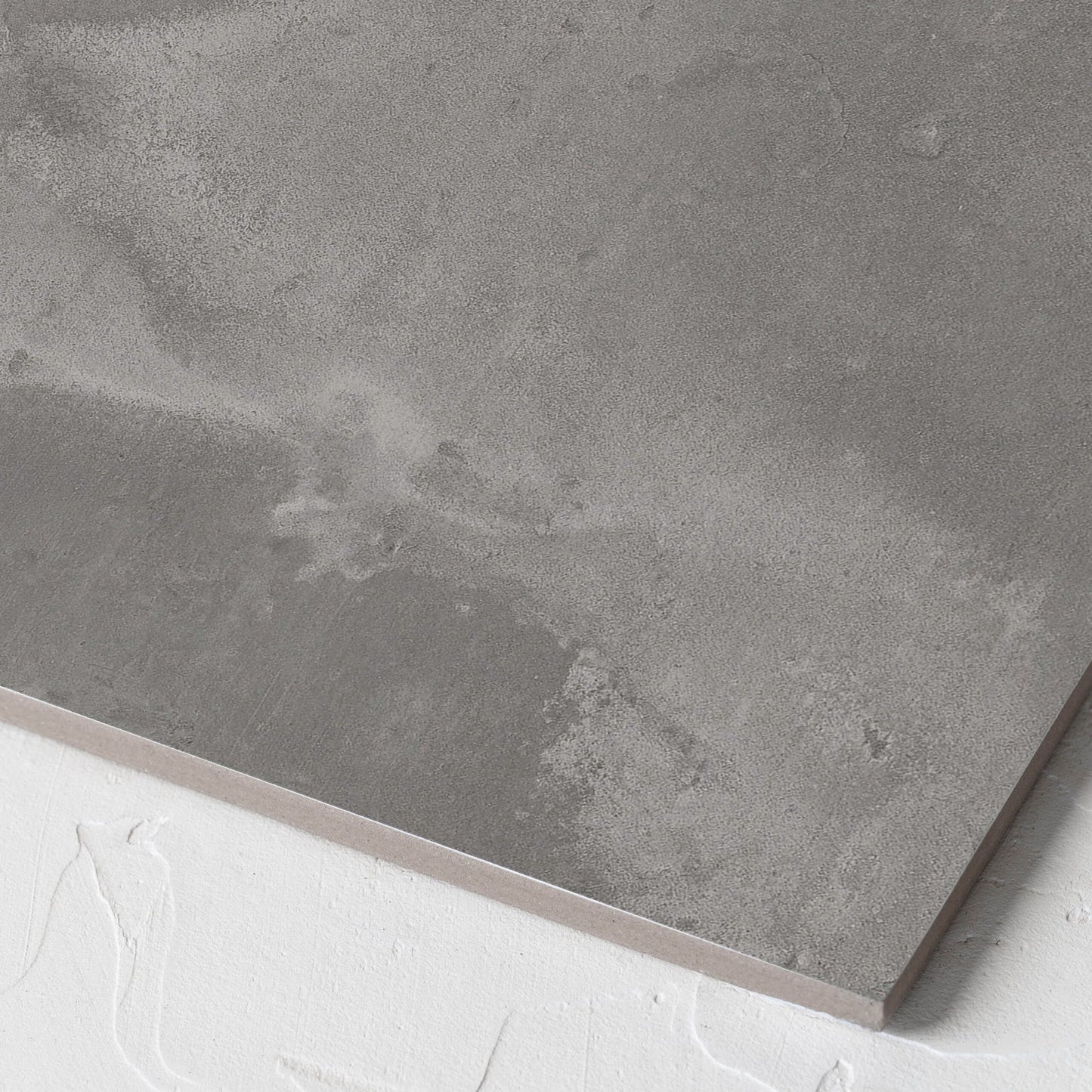 Corner close-up of the Thor Grey Matt 300x300mm tile showing the matt surface and the edge profile