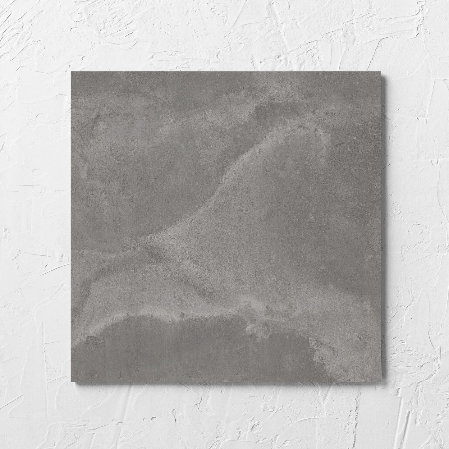 Thor Grey Matt 300x300mm tile laid flat on a white rendered wall, showing the matt surface