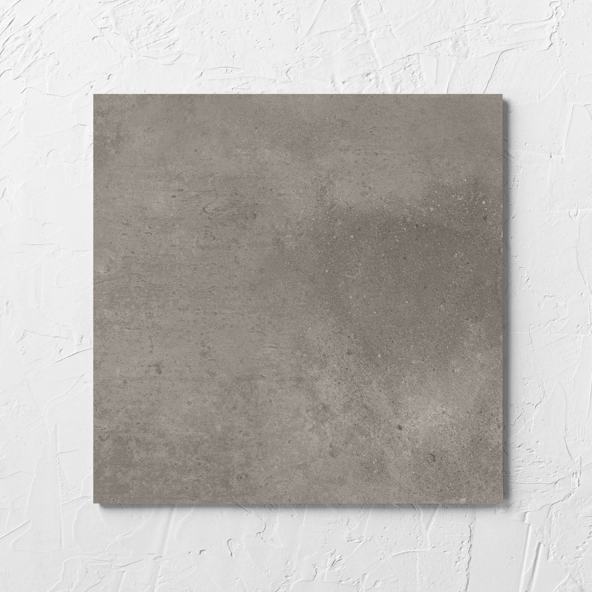 Thor Mushroom Matt 300x300mm tile laid flat on a white rendered wall, showing the matt surface