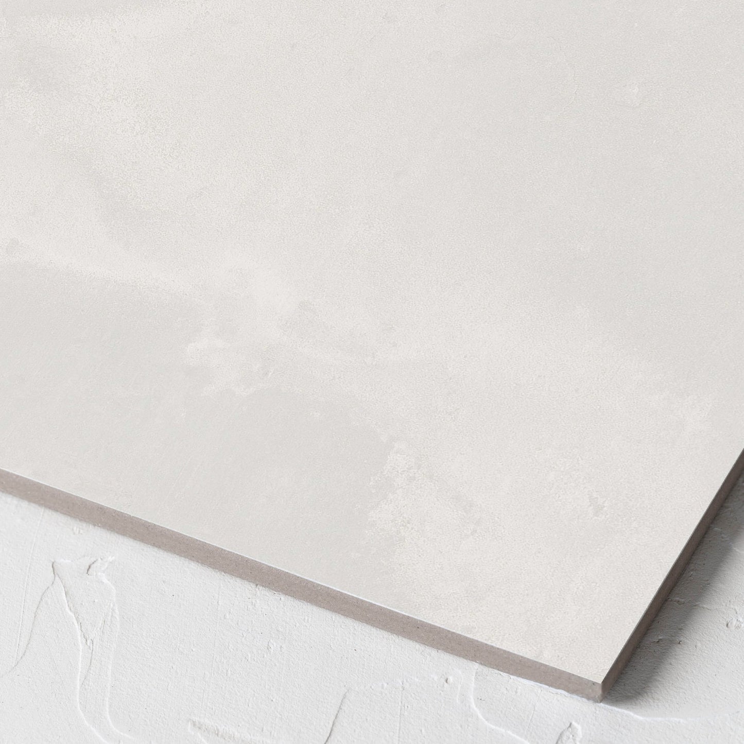 Corner close-up of the Thor White Matt 300x300mm tile showing the matt surface and the edge profile