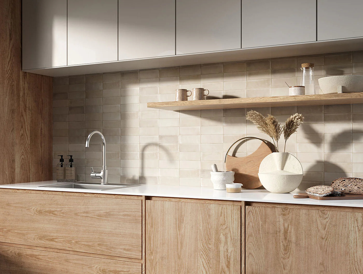 Tint Dune Matt Subway 52x160mm tiles installed as a kitchen splashback in warm beige, paired with light oak cabinetry and an open timber shelf.