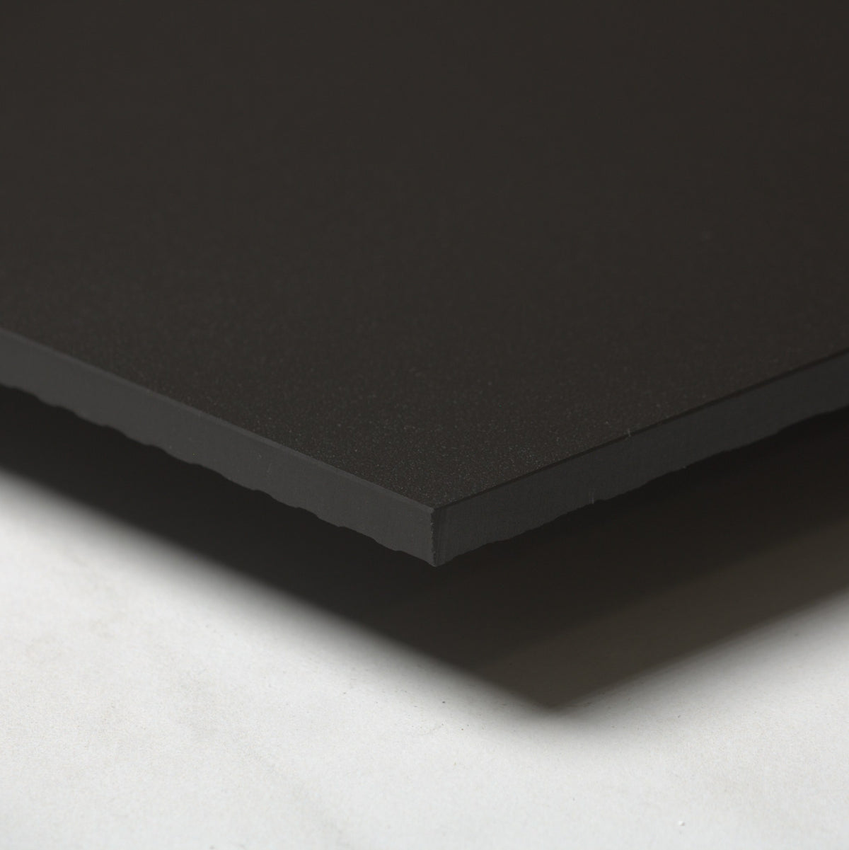 Unicolour Black Matt 600x600mm angle view showing the tile edge