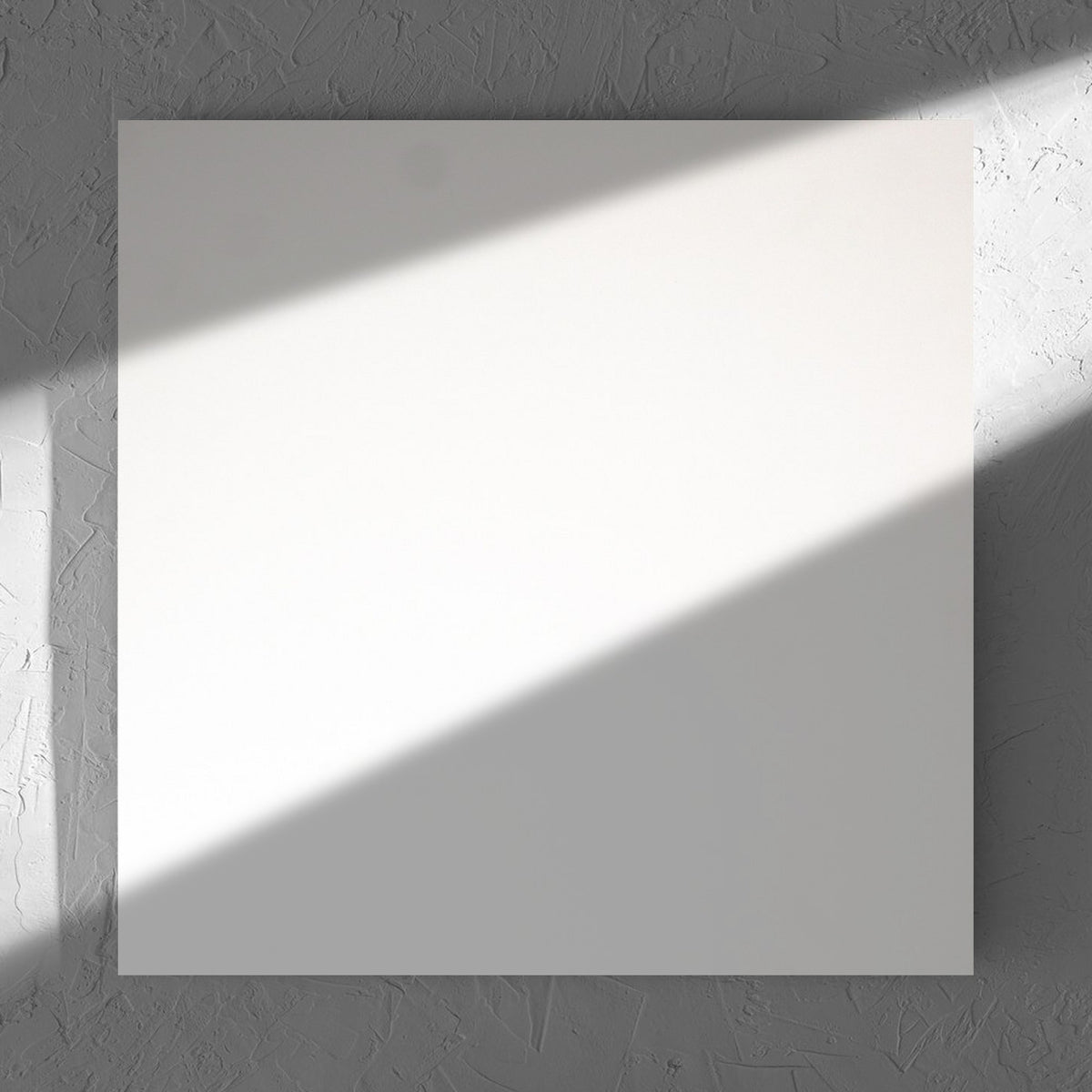 Unicolour Super White Matt 600x600mm tile in soft natural window light, showing the super white matt surface