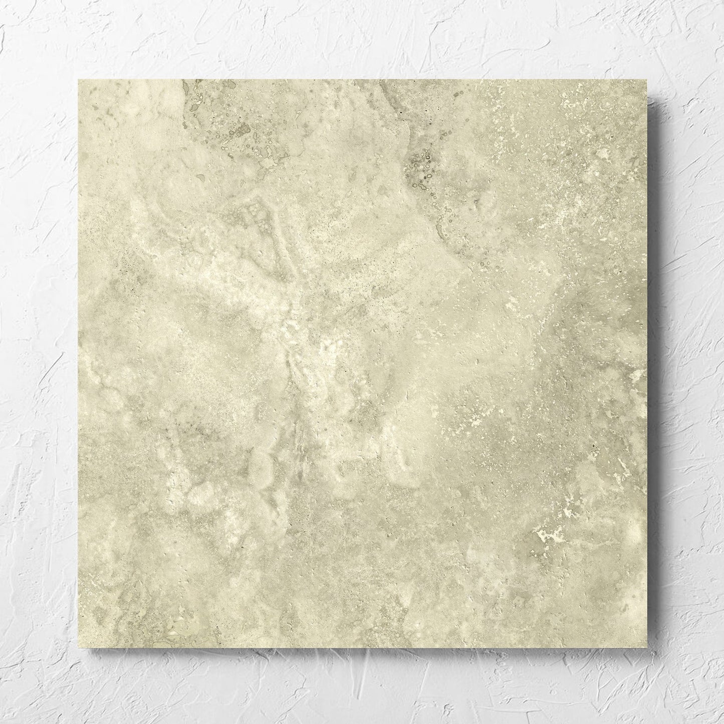 Vatican Novona Cross Cut Travertine 600x600mm tile laid flat on a white rendered wall, showing the matt surface
