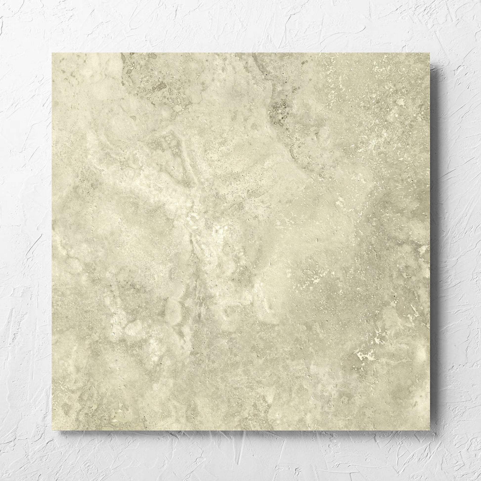 Vatican Novona Cross Cut Travertine 600x600mm tile laid flat on a white rendered wall, showing the matt surface