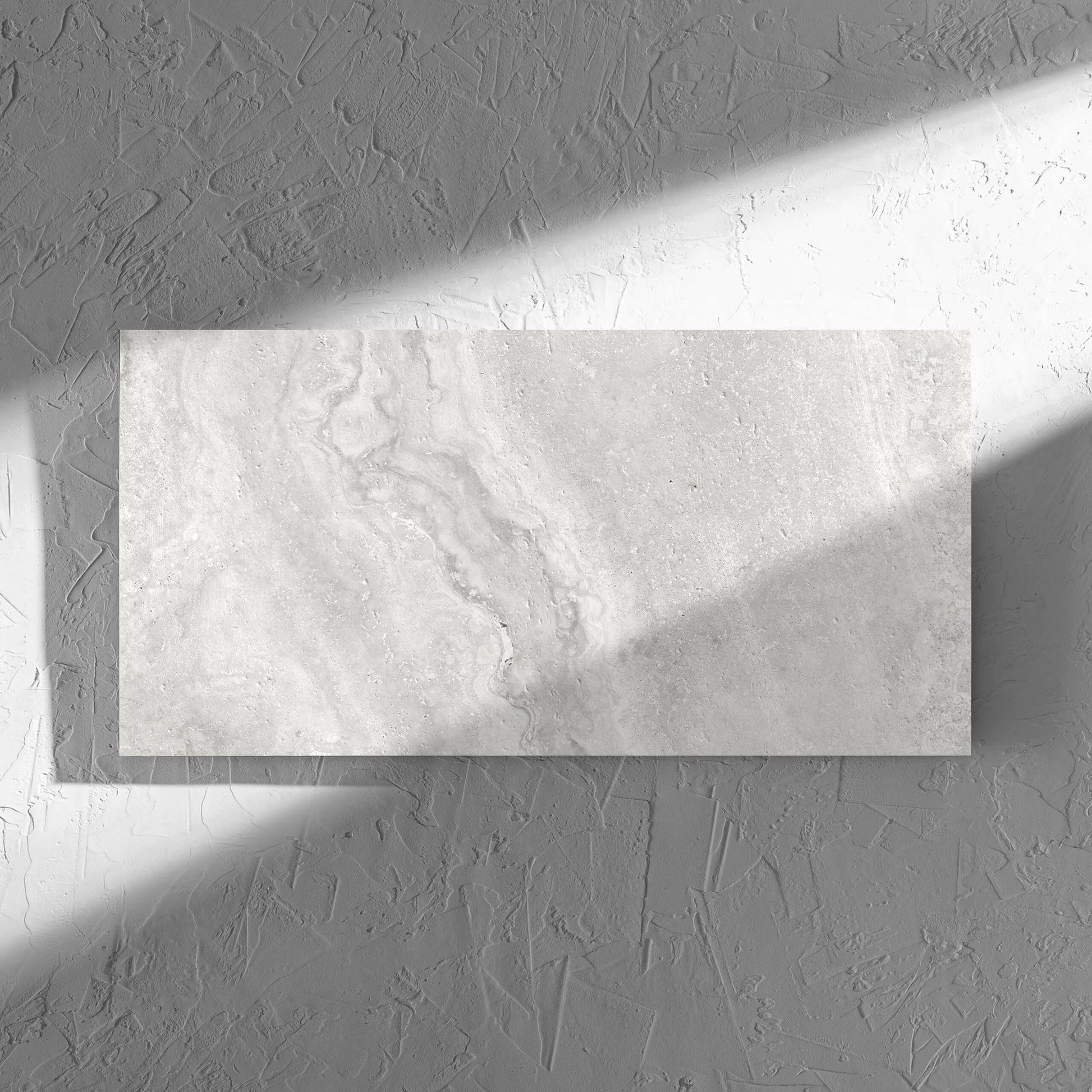 Vatican Silver Cross Cut Travertine 300x600mm tile in soft natural window light, showing the matt surface