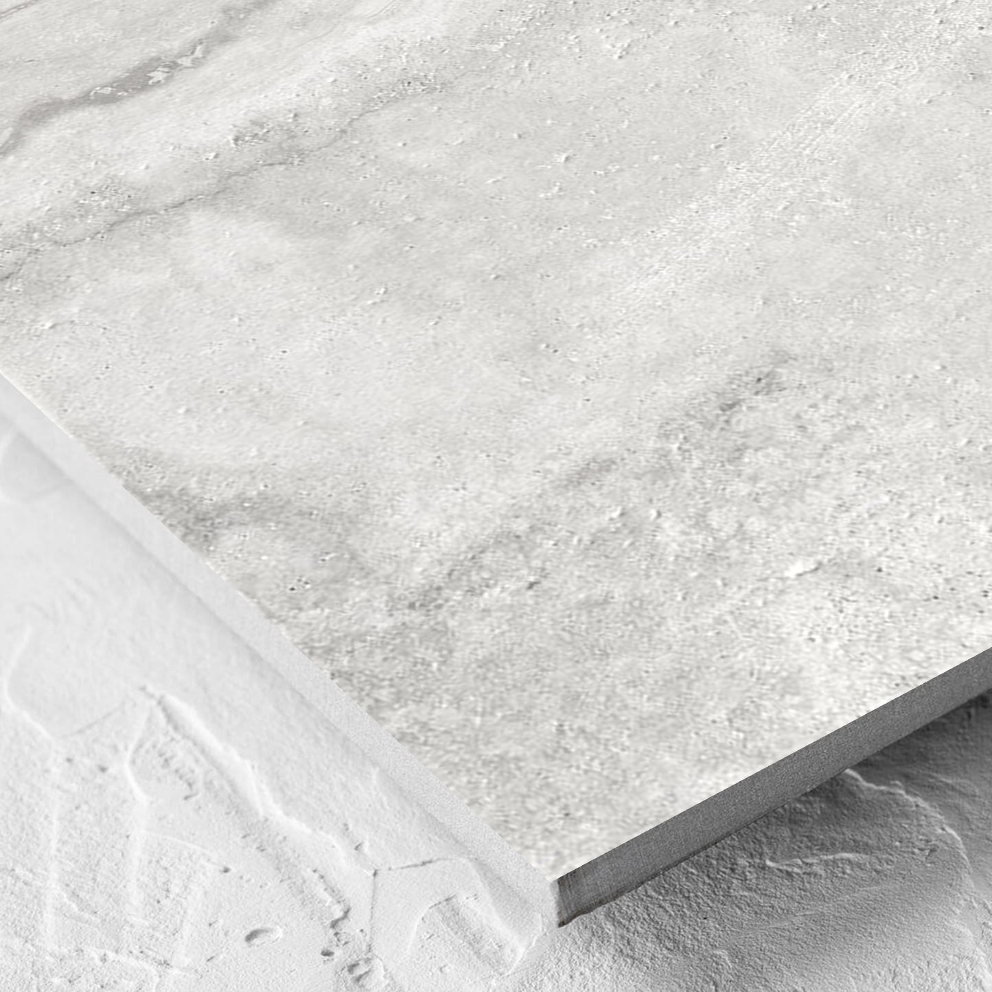 Corner close-up of the Vatican Silver Vein Cut Travertine 600x600mm tile showing the matt surface and the edge profile