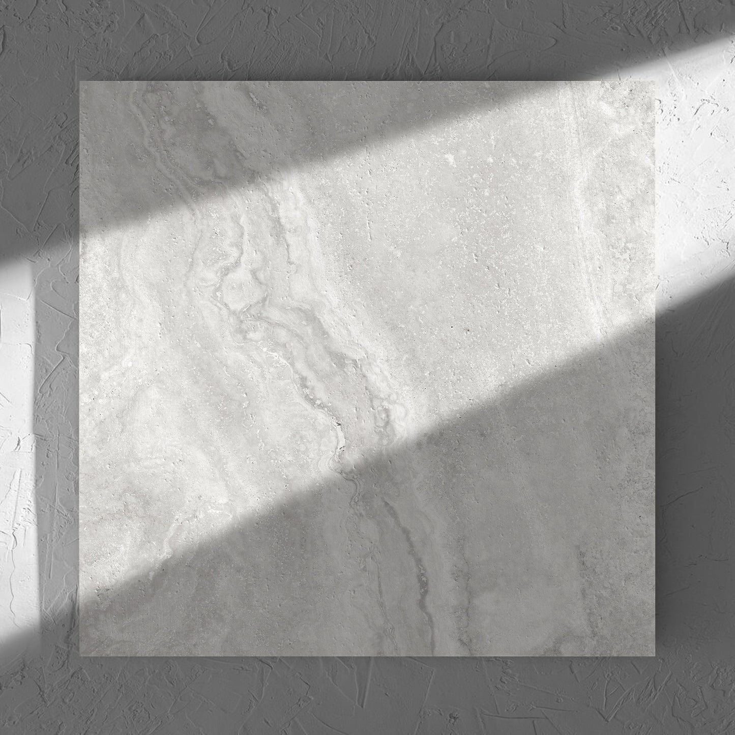 Vatican Silver Vein Cut Travertine 600x600mm tile in soft natural window light, showing the matt surface