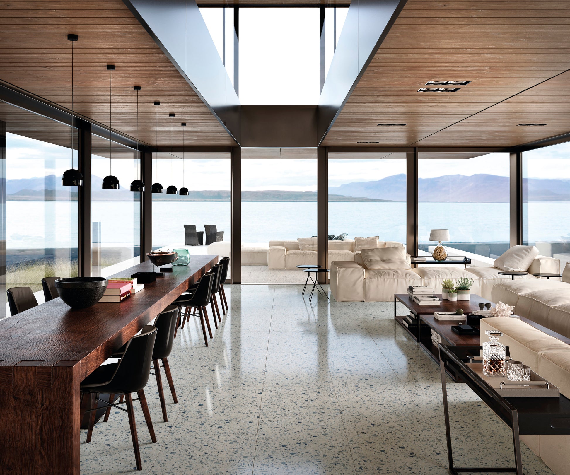 Venice Blue 600x600mm Matt Terrazzo Tile installed across an open-plan living and dining space with floor-to-ceiling windows, a timber ceiling, and sweeping lake views.
