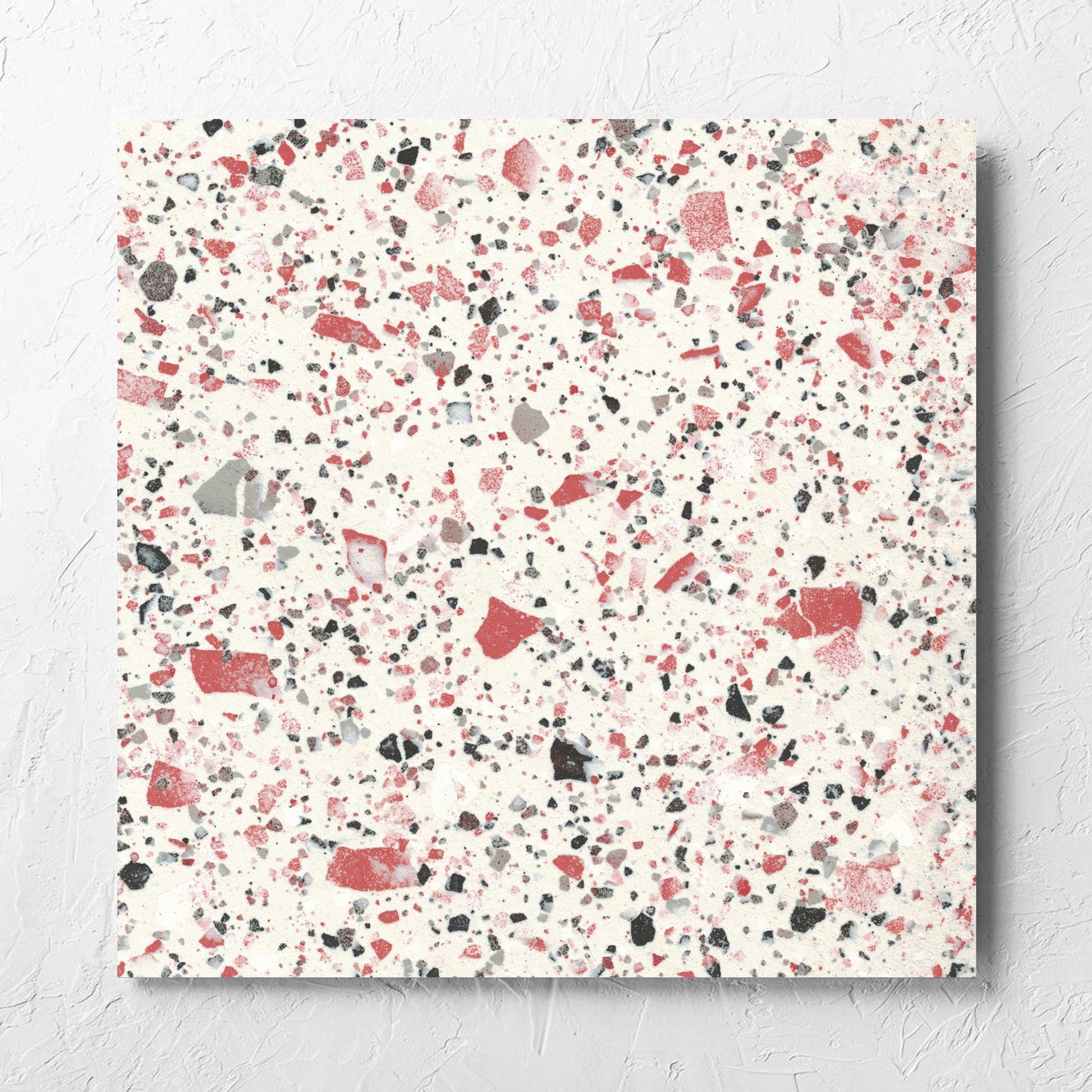 Venice Coral 600x600mm Matt Terrazzo Tile laid flat on a white rendered wall, showing the coral matt surface