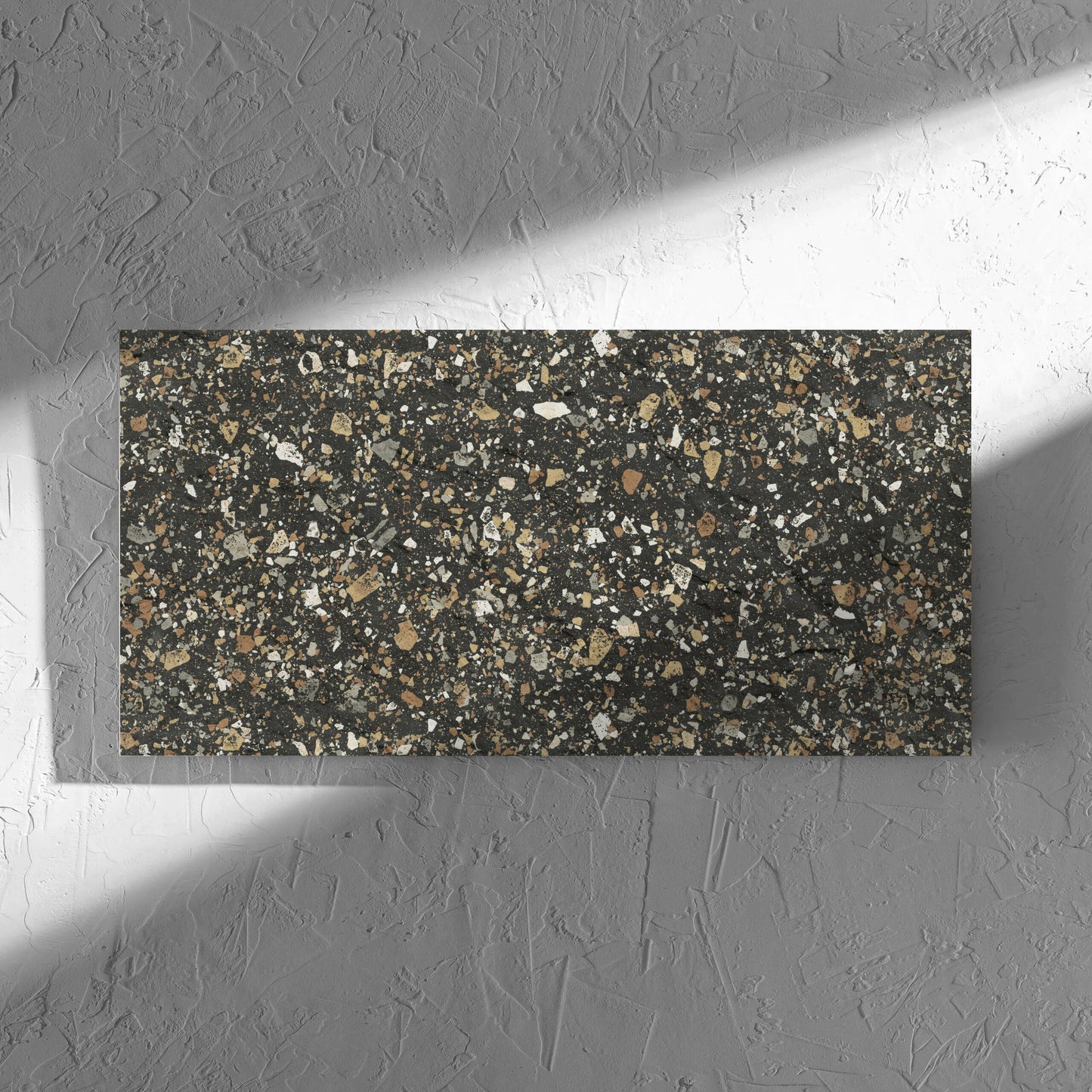 Venice Earth 300x600mm Matt Terrazzo External Tile in soft natural window light, showing the earth matt surface