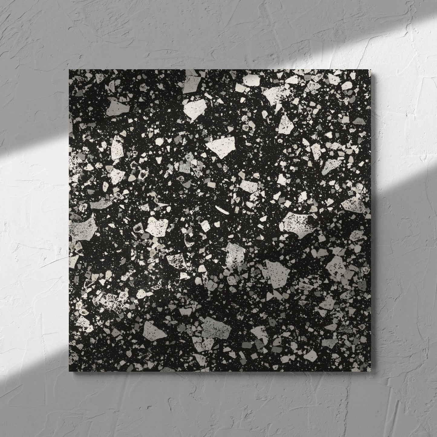 Venice Graphite 300x300mm Matt Terrazzo Tile in soft natural window light, showing the graphite matt surface
