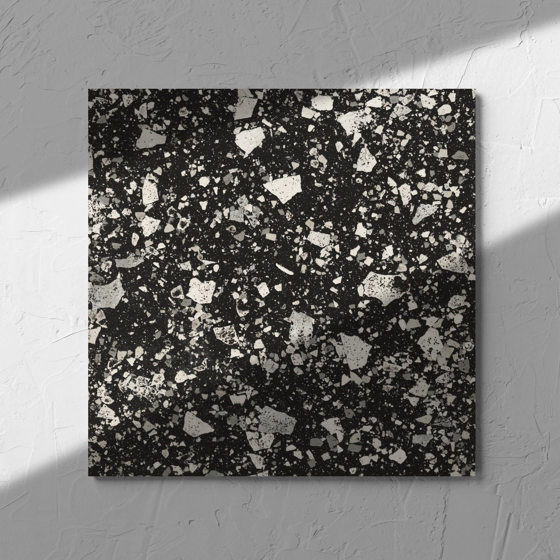 Venice Graphite 300x300mm Matt Terrazzo Tile in soft natural window light, showing the graphite matt surface
