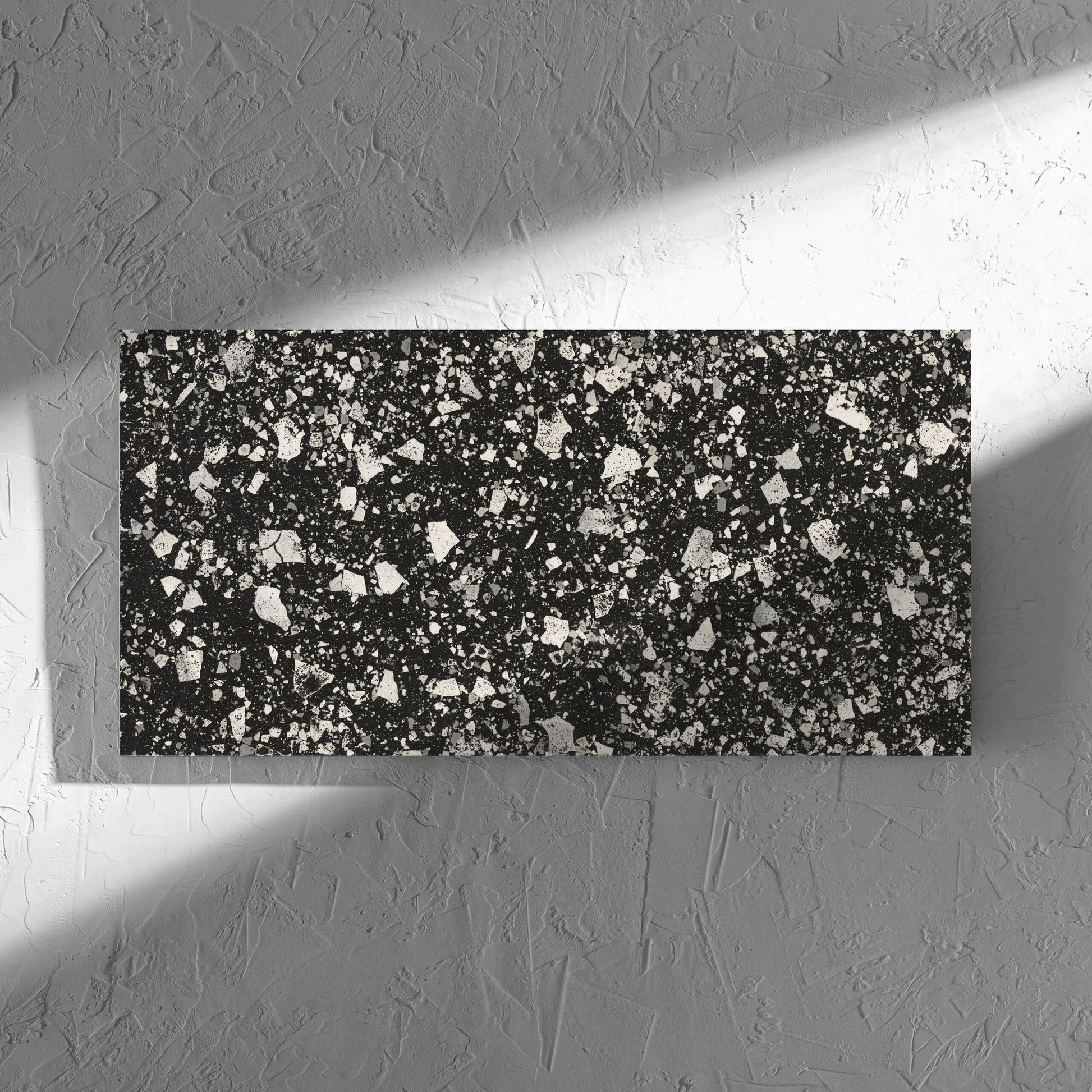Venice Graphite 300x600mm Matt Terrazzo Tile in soft natural window light, showing the graphite matt surface