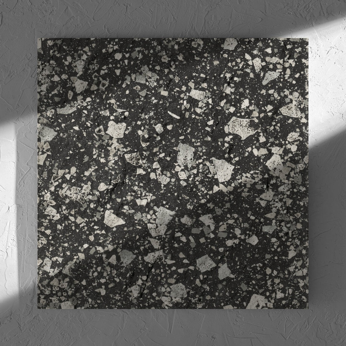 Venice Graphite 600x600mm Matt Terrazzo External Tile in soft natural window light, showing the graphite matt surface