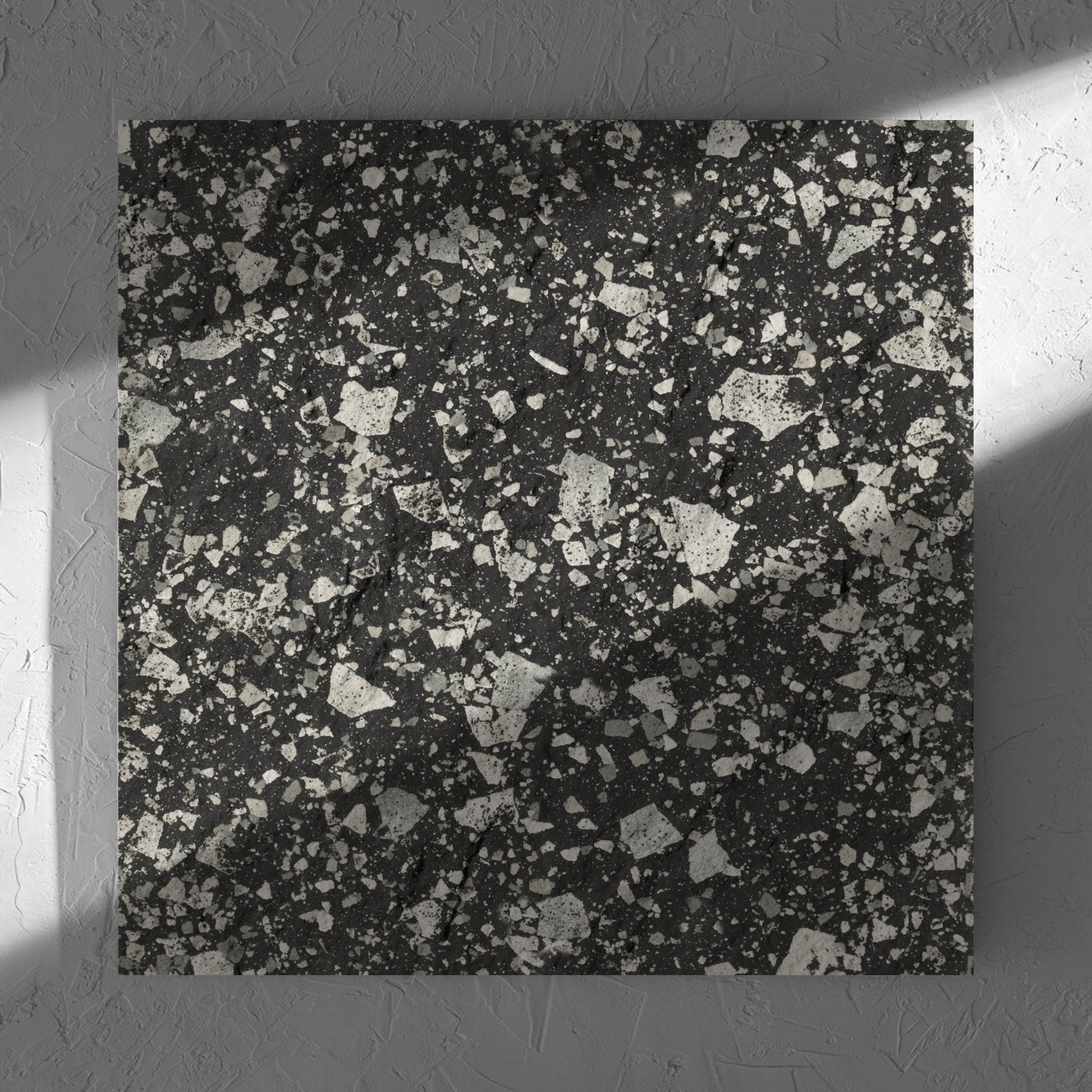 Venice Graphite 600x600mm Matt Terrazzo External Tile in soft natural window light, showing the graphite matt surface