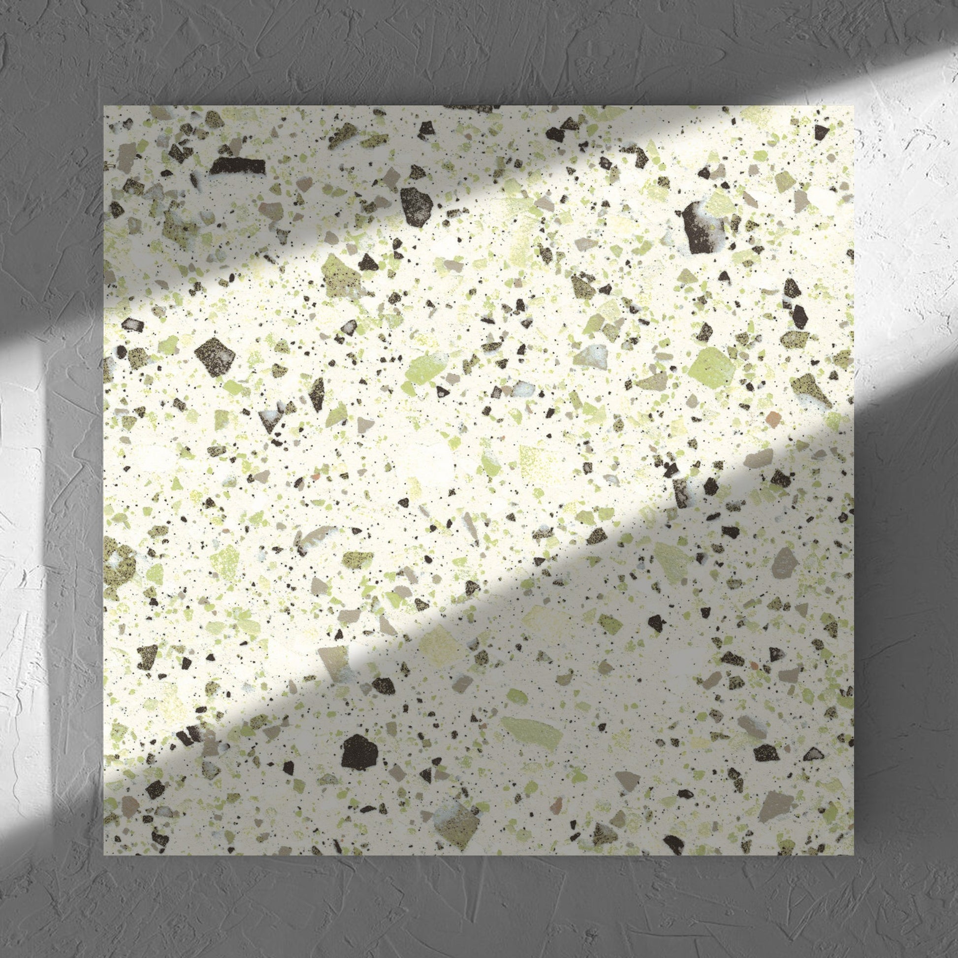 Venice Green 600x600mm Matt Terrazzo Tile in soft natural window light, showing the green matt surface