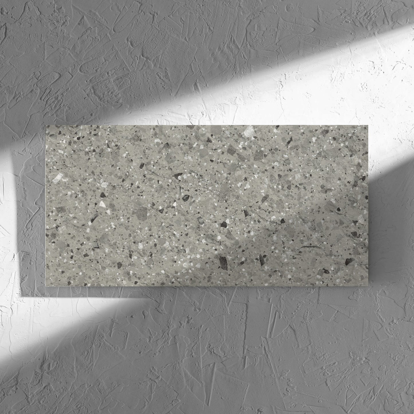 Venice Grey 300x600mm Matt Terrazzo External Tile in soft natural window light, showing the grey matt surface