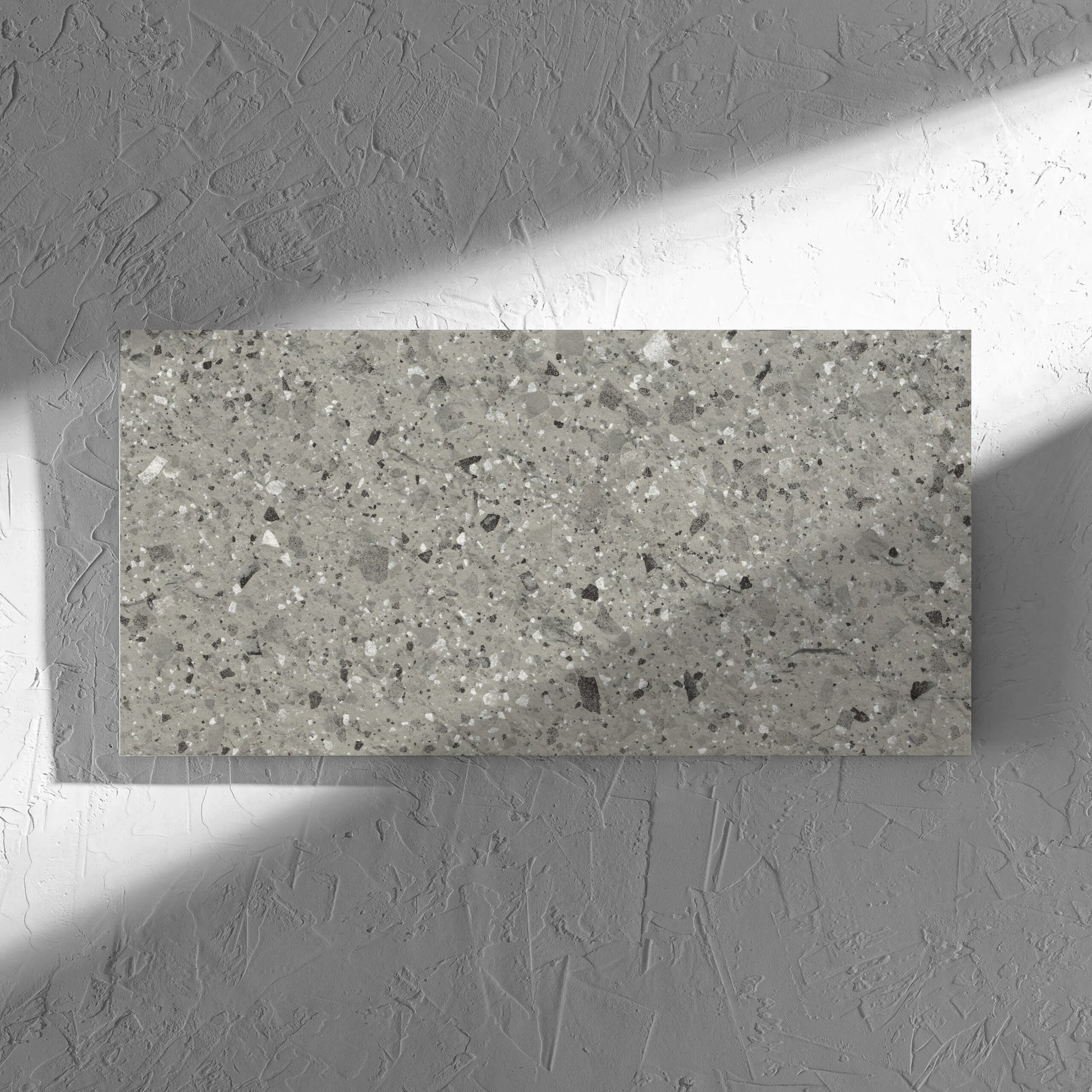 Venice Grey 300x600mm Matt Terrazzo External Tile in soft natural window light, showing the grey matt surface