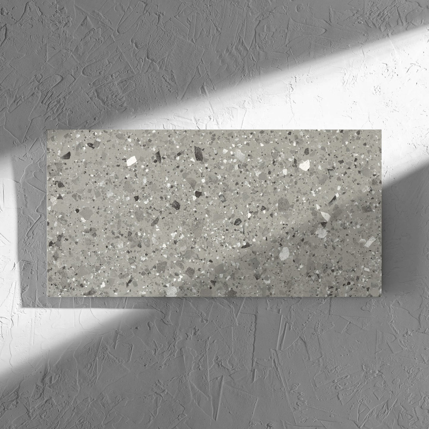 Venice Grey 300x600mm Matt Terrazzo Tile in soft natural window light, showing the grey matt surface