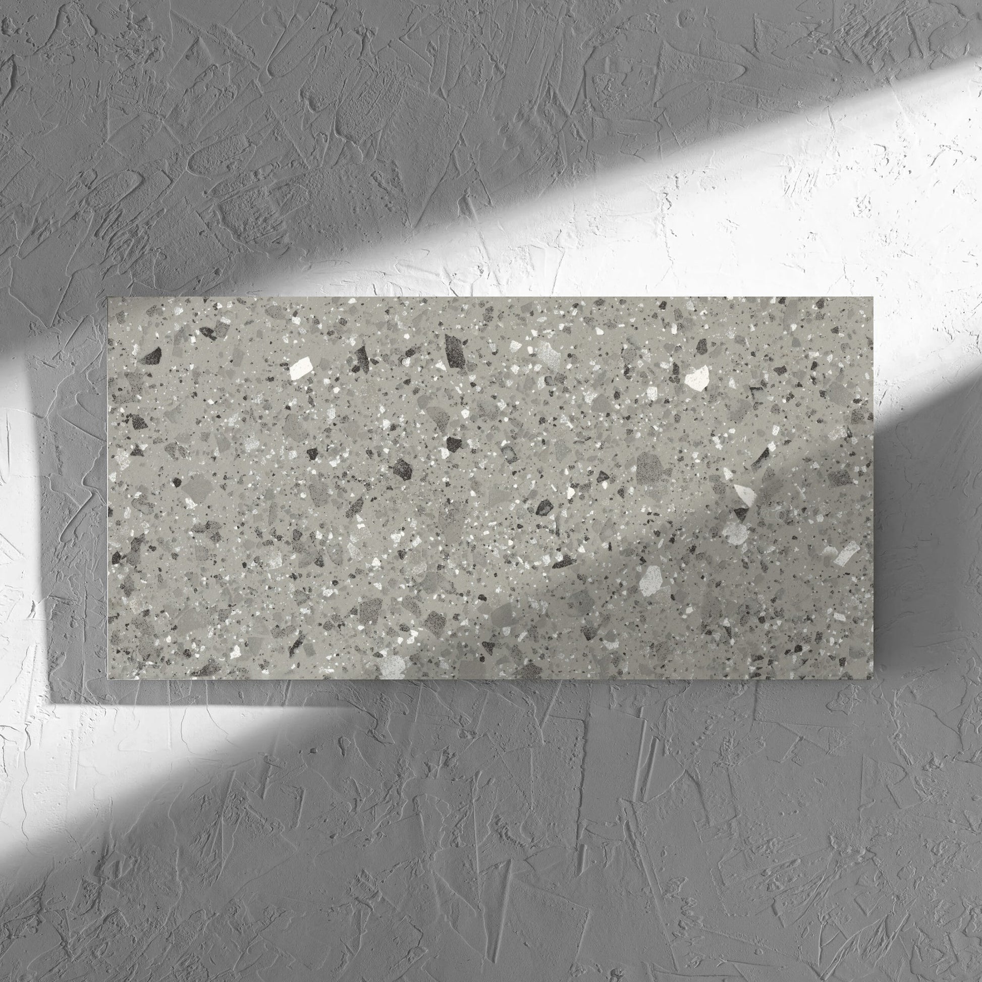 Venice Grey 300x600mm Matt Terrazzo Tile in soft natural window light, showing the grey matt surface