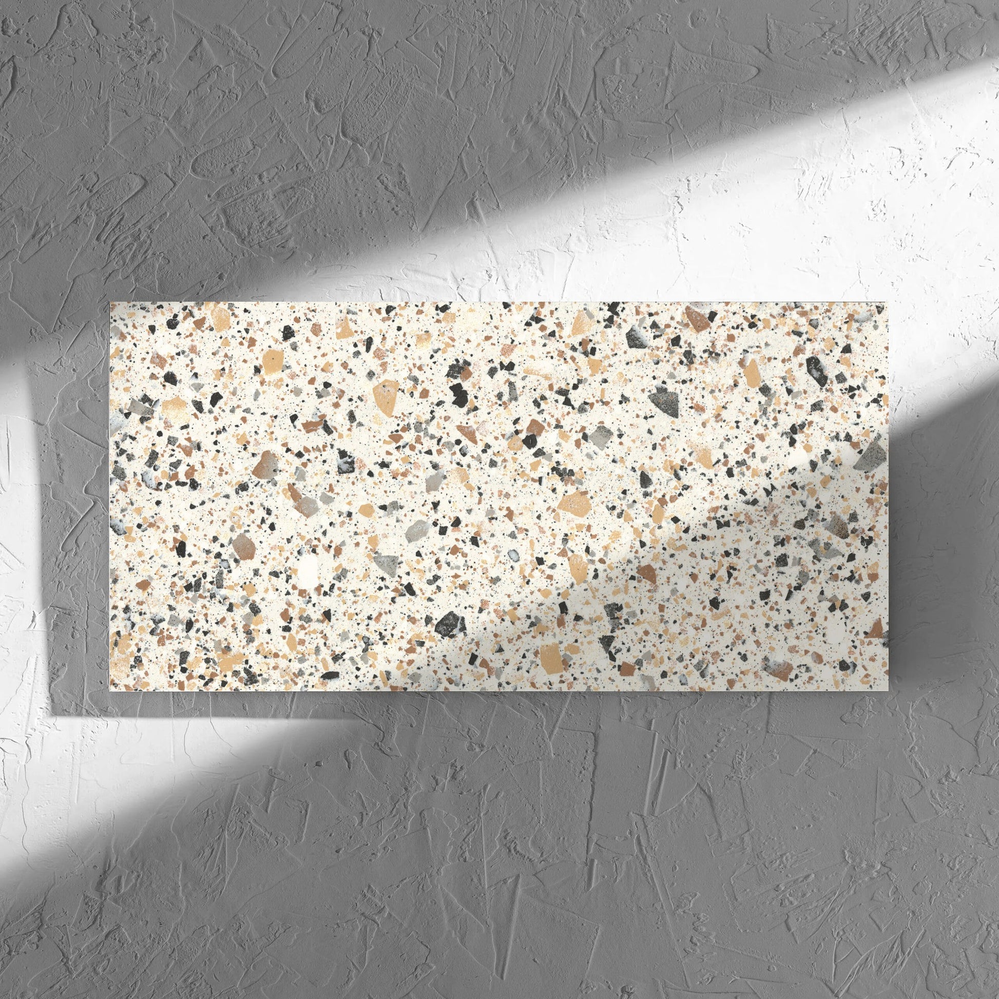 Venice Ivory 300x600mm Matt Terrazzo Tile tile in soft natural window light, showing the tile surface