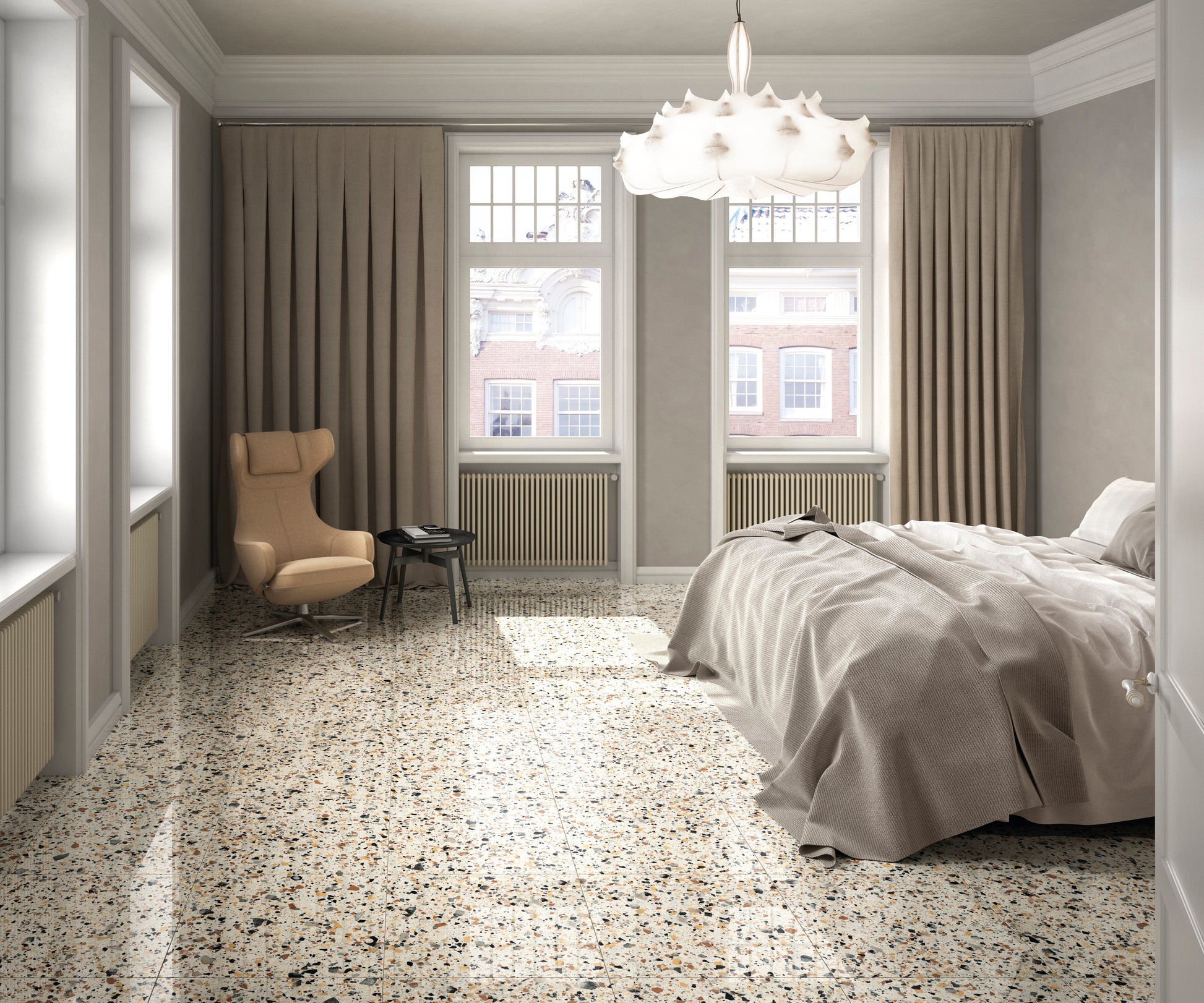 Venice Ivory 600x1200mm Matt Terrazzo Tile laid as a polished bedroom floor beneath a sculptural pendant light and wingback chair.