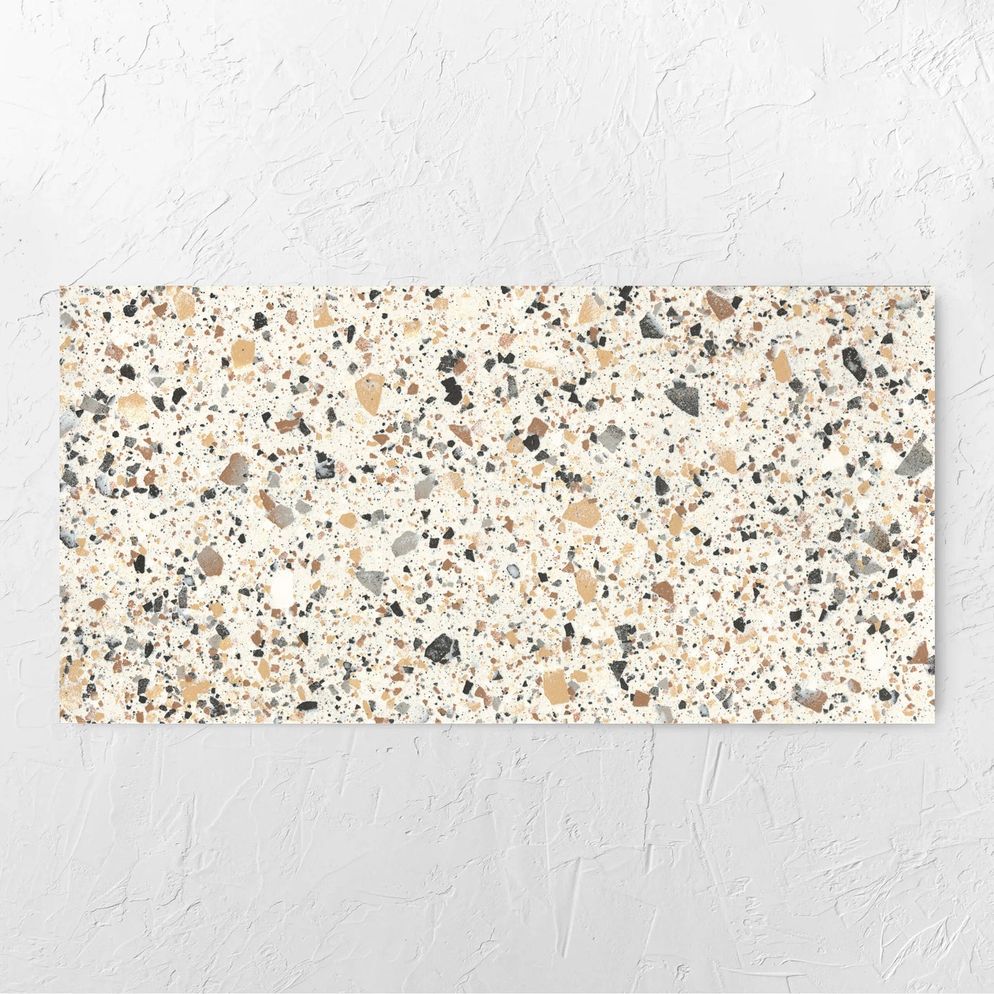 Venice Ivory 600x1200mm Matt Terrazzo Tile laid flat on a white rendered wall, showing the ivory matt surface