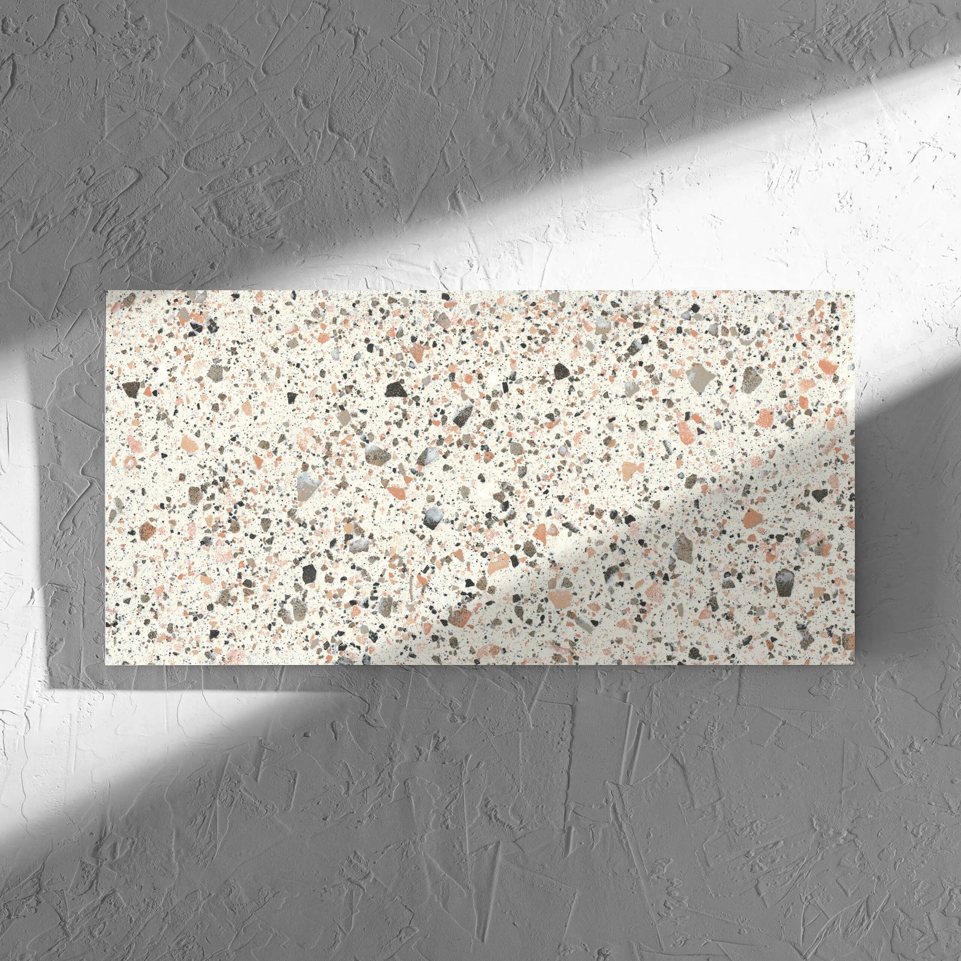 Venice Pink 300x600mm Matt Terrazzo Tile in soft natural window light, showing the pink matt surface