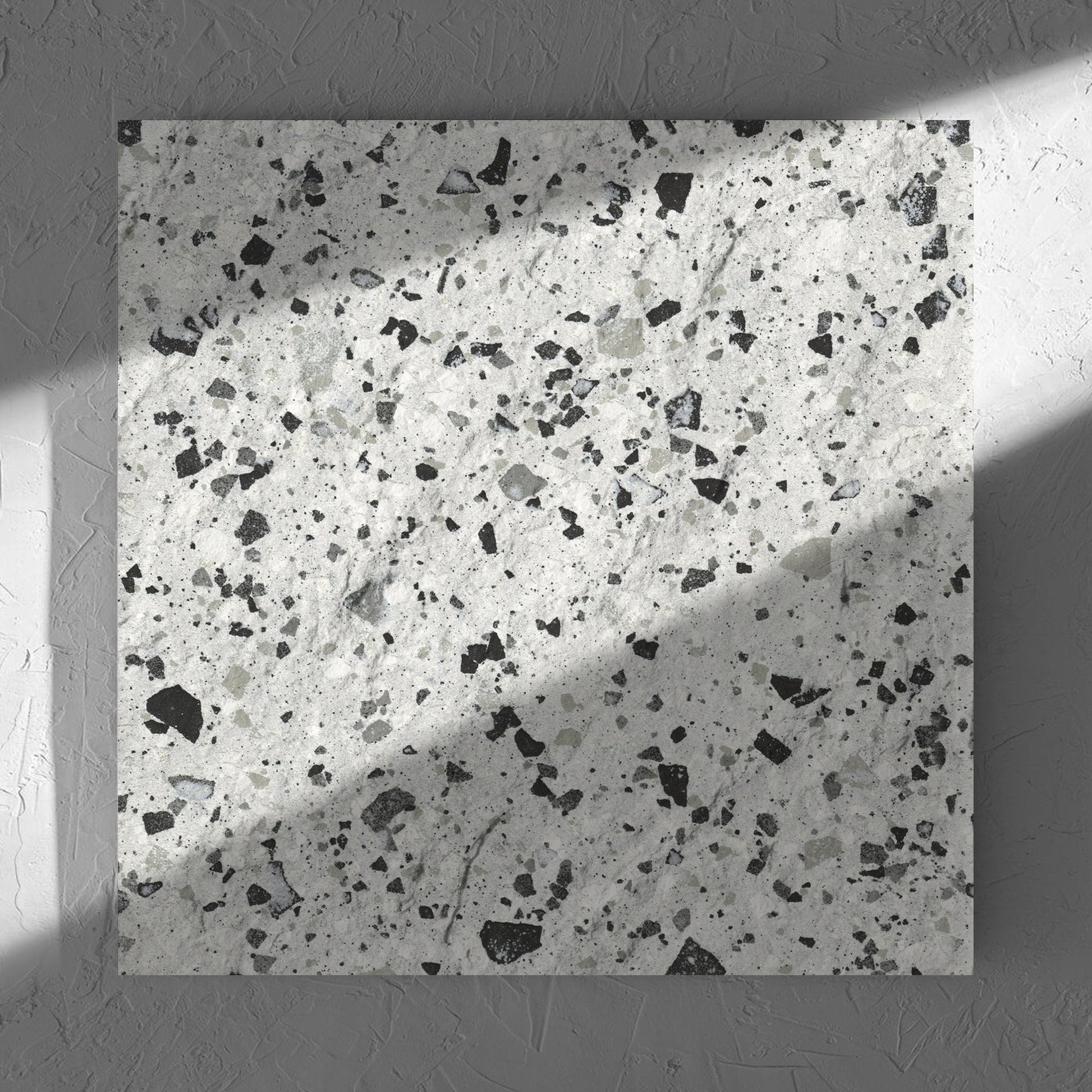 Venice Silver 600x600mm Matt Terrazzo External Tile in soft natural window light, showing the silver matt surface