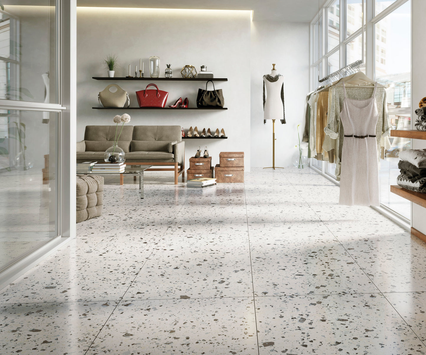 Venice White 300x600mm Matt Terrazzo Tile installed as a polished retail boutique floor with clothing racks, shelving displaying handbags, and a seating area.