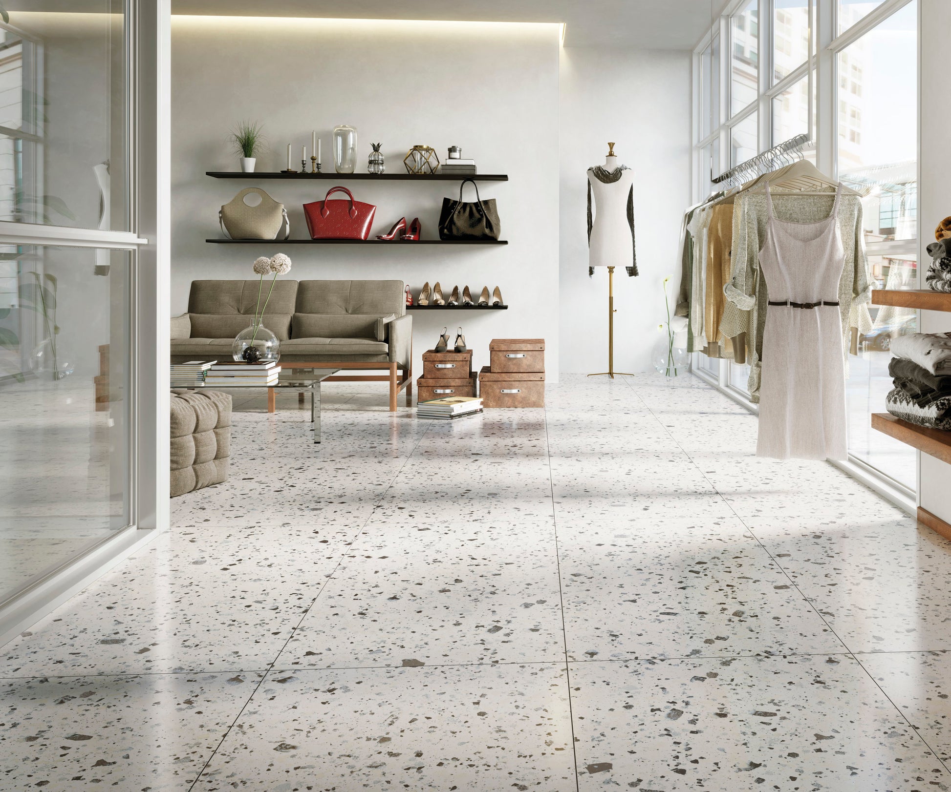 Venice White 300x600mm Matt Terrazzo Tile installed as a polished retail boutique floor with clothing racks, shelving displaying handbags, and a seating area.