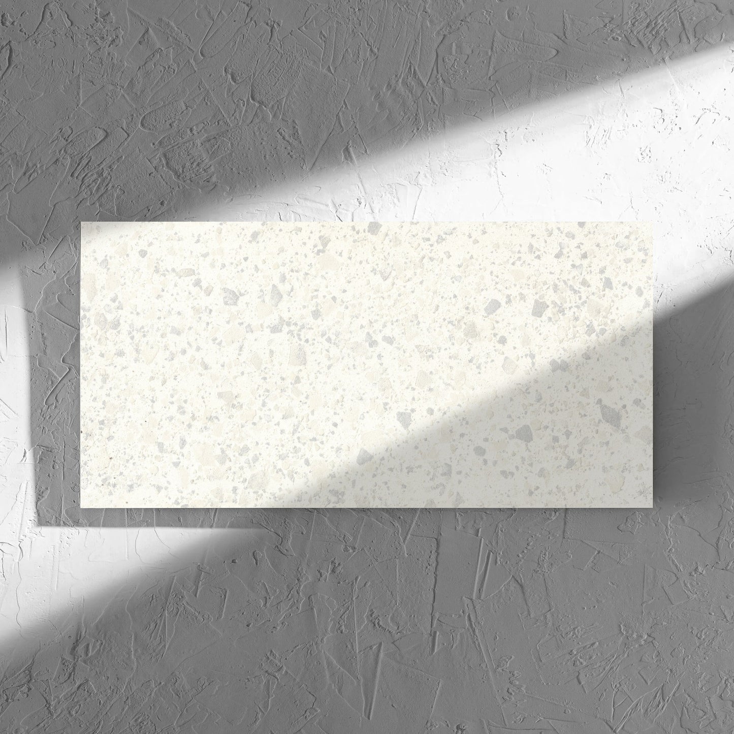 Venice Zinc 300x600mm Matt Terrazzo Tile in soft natural window light, showing the zinc matt surface