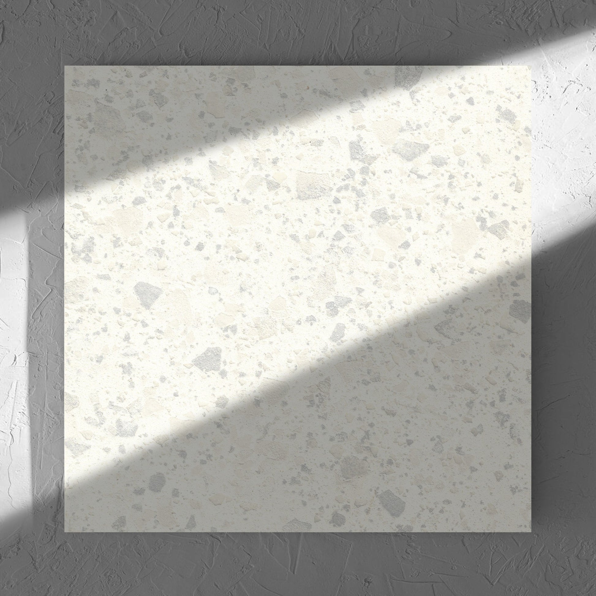 Venice Zinc 600x600mm Matt Terrazzo Tile in soft natural window light, showing the zinc matt surface