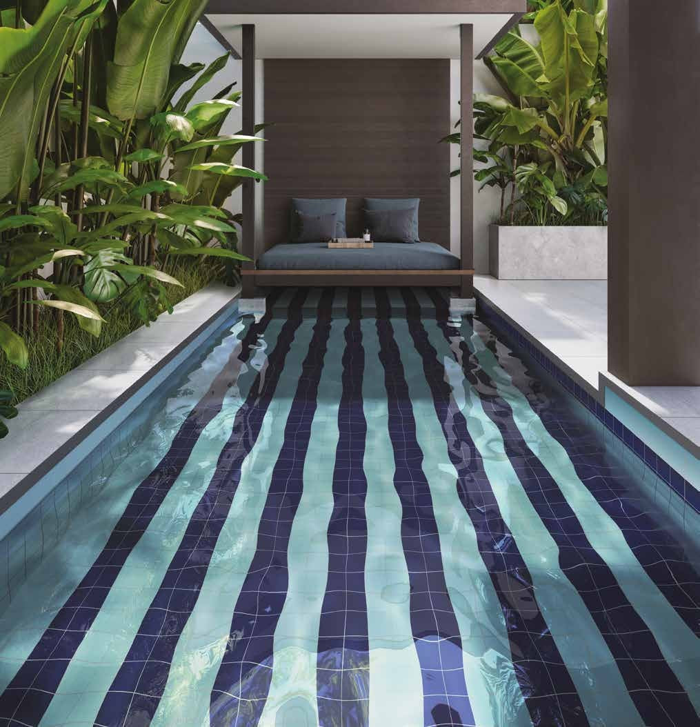 Swimming pool tiled in Pool Blue and Midnight Blue matt 10x10 stripes