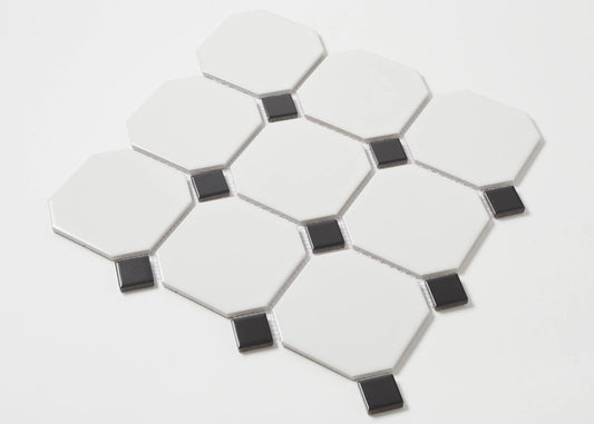 Pack shot of White and Black Matte Porcelain Glazed Octagon Large tiles showing matte white octagonal pieces with small black square dot inserts arranged in a classic pattern.