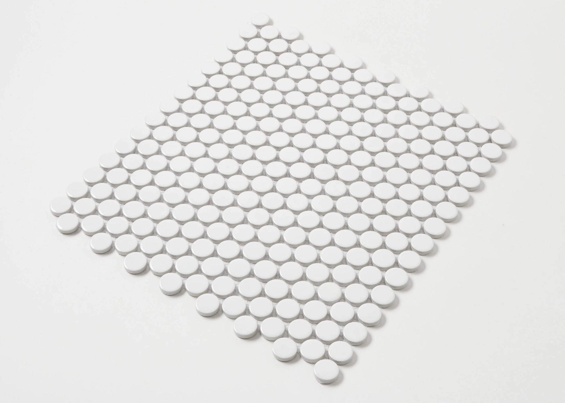 White Gloss Diameter Glazed Porcelain Penny Round 19mm tiles arranged in a diamond-shaped mosaic sheet showing glossy circular white ceramic pieces on a white background.
