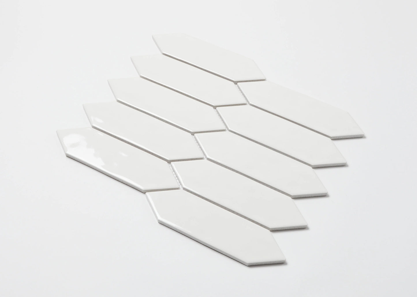 Pack shot of White Gloss Porcelain Glazed Ripple Surface Arrow 55x195mm tiles arranged in a fanned mosaic sheet showing elongated arrow-shaped white glossy ceramic pieces.
