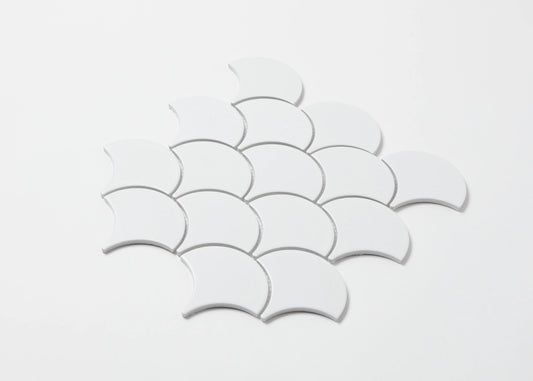 Pack shot of White Matt Porcelain Glazed Fishscale 95x87mm tiles arranged in an overlapping scallop pattern against a white background.