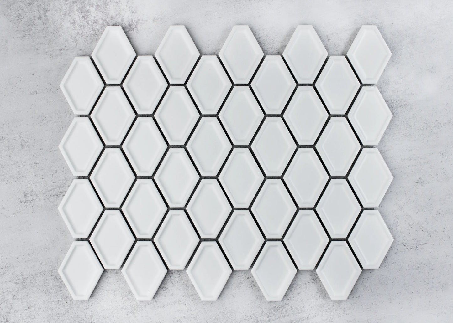 White Matte Internal Porcelain Glazed Honeycombe Internal 46.5x60mm tiles arranged in a full sheet, showcasing the elongated hexagon shape, matte white glaze, and dark grout joints.