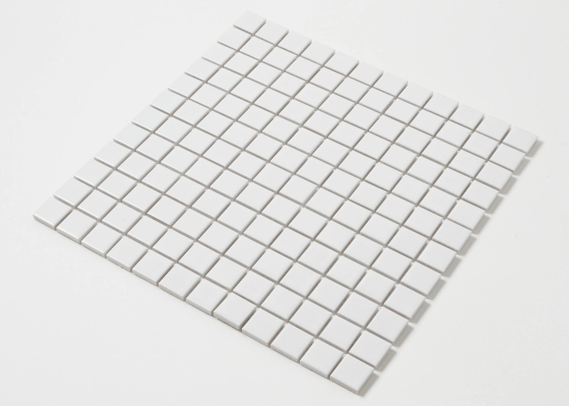 A single sheet of White Matte Porcelain Glazed 23x23mm Square mosaic tiles arranged in a uniform grid with subtle grey grout lines on a white background.