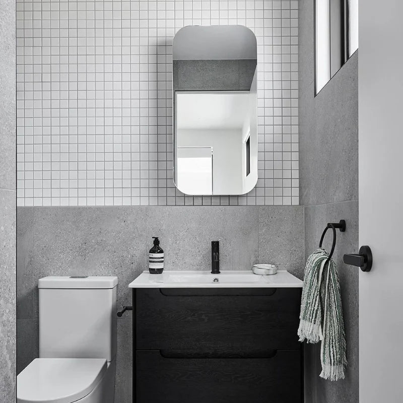 White Matte Porcelain Glazed 48x48mm Square tiles covering the upper bathroom wall above a dark timber vanity unit and black tapware.