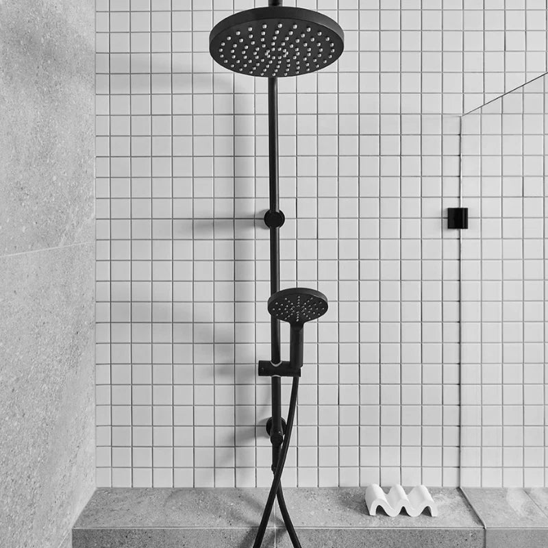 White Matte Porcelain Glazed 48x48mm Square tiles covering a modern shower wall with a matte black rain shower system and handheld showerhead.