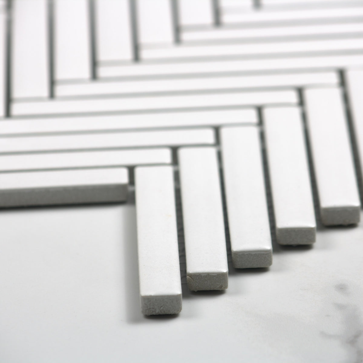 White Matt Porcelain Glazed Herringbone KitKat 12x92mm angle view