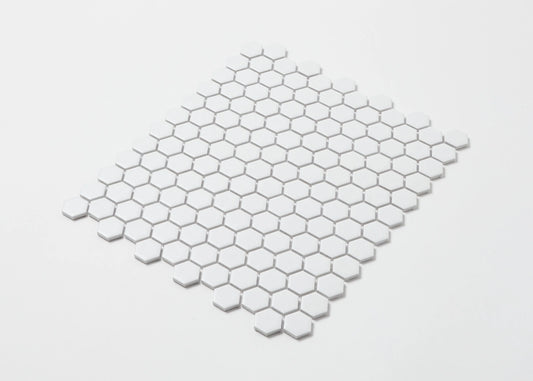 Pack shot of White Matte Porcelain Glazed Hexagon 23mm mosaic tile sheet arranged in a diamond layout showing uniform matte white finish and small hexagonal pattern.